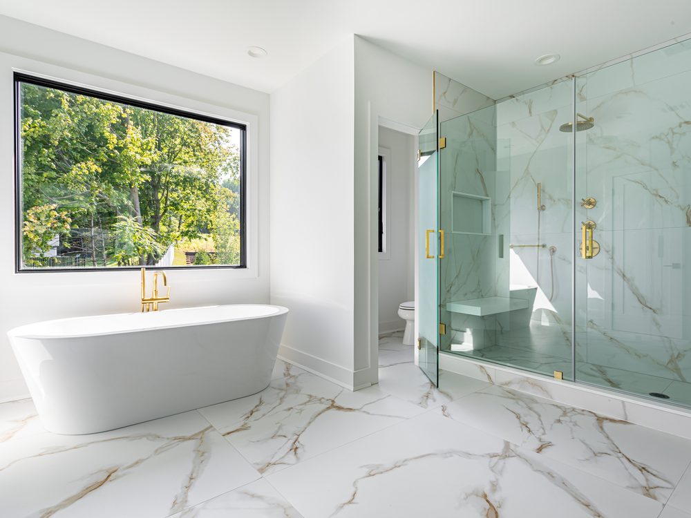 Fitted bathroom with dark tiling